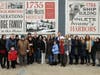 Members of Residents Forward board and staff, sponsors, elected officials and other supporters during the unveiling ceremony for the new “Town Crier” mural.