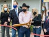 Lloyd and Laura cut the ribbon during the October 23 ceremony with help from (from left) County Leg. Delia DeRiggi-Whitton and Glen Cove Councilpeople Gaitley Stevenson-Matthews and Marsha Silverman. 