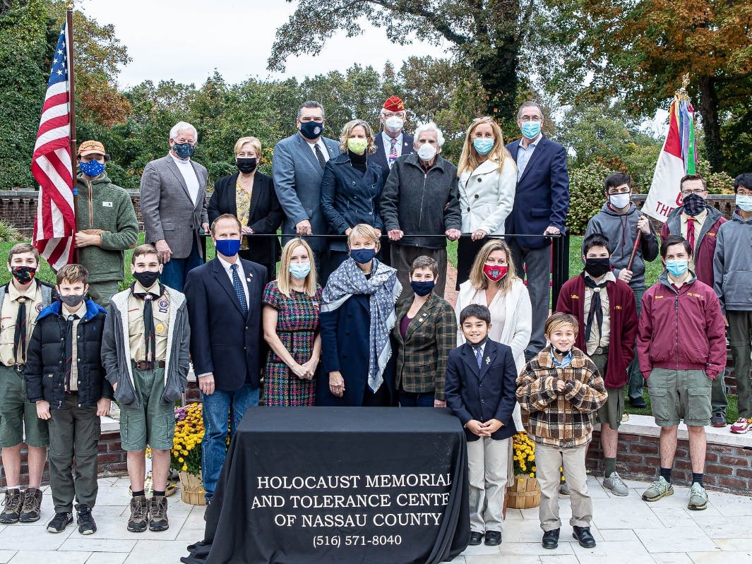 Bob Praver (3rd from right in top row) with elected officials, boy scouts, and community leaders during a ceremony where he was honored for his extensive work in the Children’s Garden.
