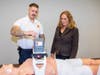 Chief Williams demonstrates the LUCAS CPR device to Legislator DeRiggi-Whitton.