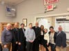 Friends and family congratulate newly appointed Manorhaven Village Judge William Bodkin following the swearing-in ceremony.