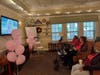 Residents enjoy watching the movie "Barbie" following the Pink Out Fashion Show.