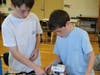Edison 7th graders Brody Henderson (left) and Max Burrick work collaboratively to design and program a robot at STEM Camp in Westfield.