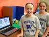 At STEM Camp, Washington 5th graders Emily Gaeta (left) and Molly McDermott create an animated movie clip, capturing one frame at a time as they painstakingly move physical objects between each frame.