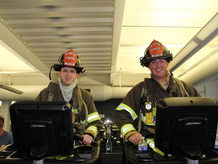 Michael Sowell and Rob Kelly climbed 110 flights on a stair machine while in full gear to pay tribute to those who died on Sept. 11, 2001.