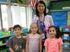 Jefferson School principal Dr. Susie Hung poses with first graders (L-R) Oliver Ort, Allison Reilly, and Allyson Mintz in mismatched clothing to reinforce respect for differences during the Week of Respect.