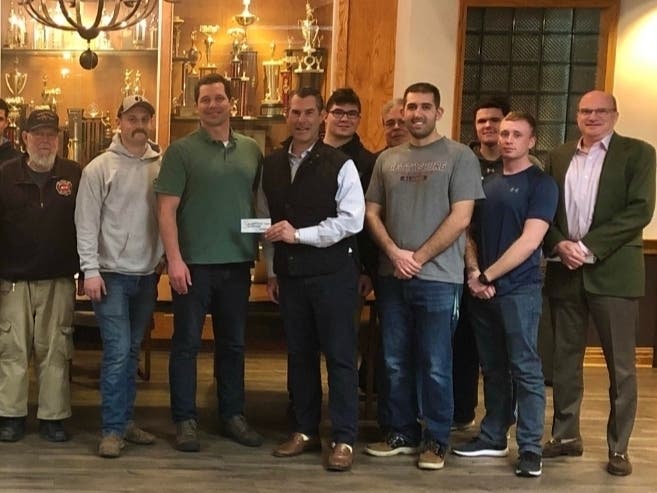 The volunteer squad for the township received the check from the race committee. 