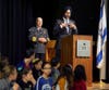 Attorney General Grewal addresses the unity Rally, and Sheriff Gannon looks on, with youths from Gottesman RTW Academy in the foreground