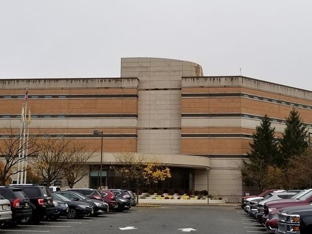 Ten percent of the staff and 6 percent of the inmates have tested positive for COVID-19. An inmate's wife says the jail is partly to blame. 