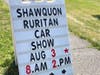 Shawquon Ruritans promote annual car show on Main Street next to Newtown Commons to passing pedestrians and drivers.