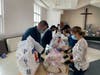 Volunteers assemble food packets at Trinity Presbyterian in Herndon.