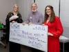 Iva Rebecca Butler, left and Karen Cunningham presented a donation check to MUST Ministries’ Kendall Jones.