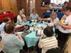 Women from a dozen area Lutheran churches gather to make "pamper me" packages for new and expectant moms who will reside at the new Redeeming Life Outreach Ministries maternity home in West Dundee, Illinois [https://www.rlom.org/expansion].