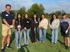 [L to R] Rev. James Buckman (Faith Lutheran Church/Lake Forest), scholarship students Diana V., Melany M., Yasmin F., Melani M., Edith S., and North Chicago Class of '70 alumnus Stan Pasiewicz at the 2025 Faith on the Fairway, Foss Park Golf Course.