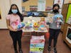 Athens High School Project Lead members Divya Thirukumaran, junior (left), and sophomore Shreya Bala, share some of the donations collected by the service club to benefit The Bottomless Toy Chest in Birmingham.