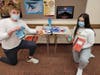 PHOTO A: Athens High School Student Council sophomores Cooper Batzold, left, and Emma Leonard share items collected for Friends of Foster Families.