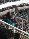 Nicholas Coulter captures fans video at Sharks game.