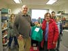 Niles Family Services Director, Darren Brown, Niles-Maine District Library Executive Director, Susan Dove Lempke, and library staff after dropping off Thanksgivings dinner bags.