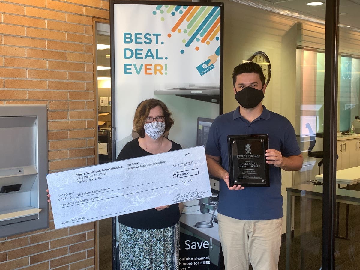 Executive Director Susan Dove Lempke and Public Relations and Marketing Supervisor Sasha Vasilic with $10,000 check and plaque.
