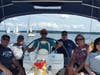 Appreciative veterans & guests pose aboard "Hoonigan" with volunteer skipper & crew.