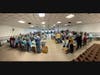About 100 volunteers came to gether to package meals.
