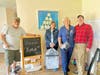 Rotarians Dave Borowski, Pat Borowski, Leslie Atkins and Preston Atkins put some finishing touches on a new apartment.