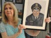 Sherry Lowman is proudly holding the Charcoal and soft pastel portrait of her beloved late husband that she commissioned to honor Kenny Lowman's life and legacy as a respected Sergeant of the Stamford Police Department during the 1950's through 70's.
