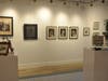 A view of the gallery showing Fine Arts Portraits in Charcoals of small, adorable children, and pets.