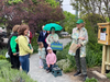 Ayr Hill Garden Club President Cherie Lejeune, launching the Little Library on the W&OD Bike Trail in Vienna. Mayor Linda Seeman Colbert, also spoke at the launch and read books to the children. 