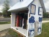 Located at the Dedham Corporate MBTA station, this Little Free Library, painted by Artist/Educator Clarissa Robyn, is already undergoing structural repairs, and will be one of the first to be repainted and restored. 