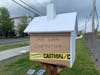 Located at the Dedham Corporate MBTA station’s drop-off/pick-up area, this Little Free Library, which was painted by Artist/Educator Clarissa Robyn and entitled  "Celebrating Dedham Pottery," is already undergoing structural repairs.