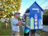 Sal D’Antona faithfully repaints the little library in the style of Cindy Mootz’ original design.