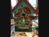 Detail of the little library, entitled “Poppies,” being painted in Sue Hoy’s art studio. 