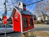 Patrons of the Dedham Little Free Libraries are encouraged to "Take a Book Give a Book."
