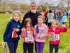 Best-selling children's book author Peter H. Reynolds poses with North Star Kids Ramble winners.
