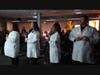 Northwestern College Winter Quarter Nursing graduates Julian Gonzales, Latoya Holliday, Charron Johnson, & Matthew Rouba hold lanterns during their Pinning Ceremony, symbolizing Florence Nightingale's passing of the flame. 