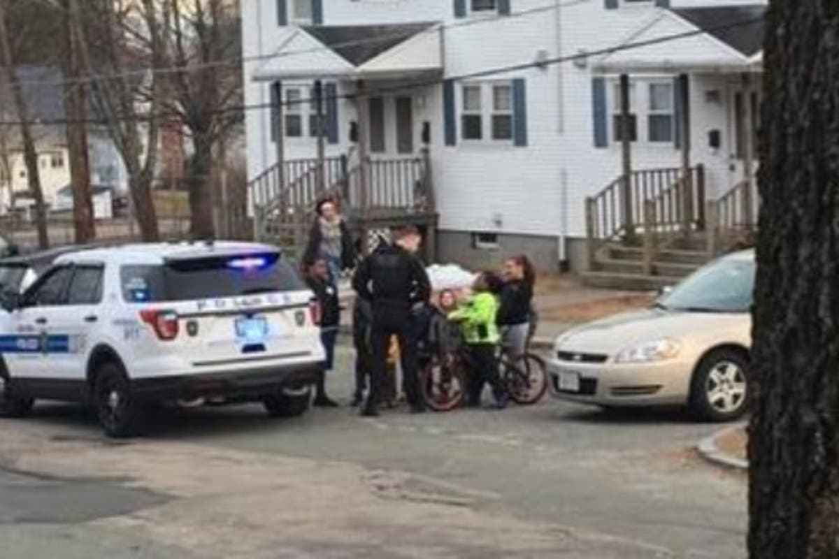 Officer Kevin O'Loughlin talked to kids who flagged him down on West Maple Street and Luby Avenue.