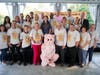 Participants in the Ninth Annual TruMark Financial Kiss-a-Pig Financial Literacy Fundraiser gathered at the Abington Art Center on Oct. 2, to kiss a pot-bellied pig named Raines. More than $35,000 was raised to support financial literacy programs in area 