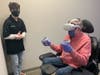 Ari Evans, Director of Esports, helps a guest check out the Virtual Reality gaming area at Metro Esports on its opening day. Metro Esports, an esports lounge and technology-based education center, is the first facility of its kind in Bucks County. 