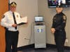 Warrington Township Chief of Police Daniel Friel reads an Officer to Sergeant Proclamation to Sergeant Jessica Bloomingdale during her promotion ceremony held on April 28, 2021.