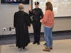  Pictured with Jessica Bloomingdale as she recites the oath are her children and the Honorable Jean Seaman. 