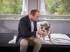 Ryan Tessler, representing Bensalem High School, was not at all reluctant to feed a pot-bellied pig named Raines, at TruMark Financial’s Feed-Or-Kiss-A-Pig Financial Literacy Fundraiser. The school has participated in the event since 2012. 
