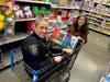 Officer Kimberly Errigo, got carried away at the “Shop with a Cop” event held on December 7 at the Walmart Supercenter in Warrington, Pa.  A Walmart grant and donations from Warrington Rotary Club helped cover the cost of the gifts. 
