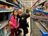 A Warrington Township police officer and student pose for a photo after choosing a gift during the fifth annual “Shop with a Cop” event. 