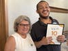 Maria White, NOVA Thrift Shop Manager, poses with Woody Poles, a NOVA Thrift Shop Volunteer, who was honored at the event for 10 years of service to the organization.