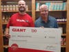 Shawn Calafaty. Store Manager, Giant Supermarket of Warminster presents a $10,000 check to Mike Cerino, Executive Director, Warminster Food Bank. 