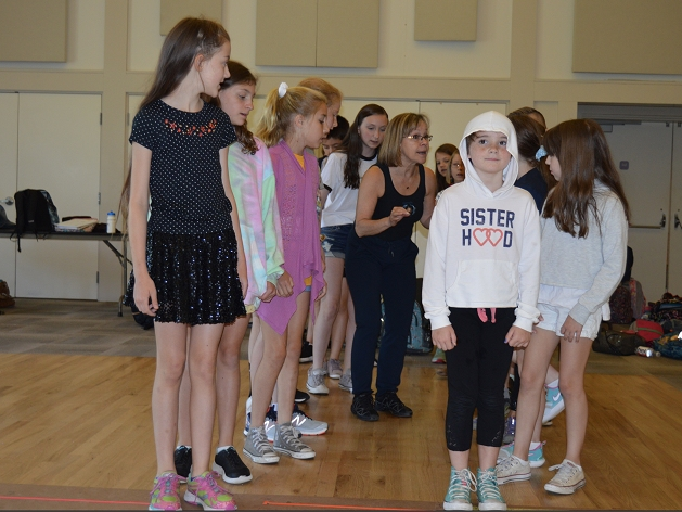 Choreographer, Linda Talcott Lee, with members of the young ensemble.