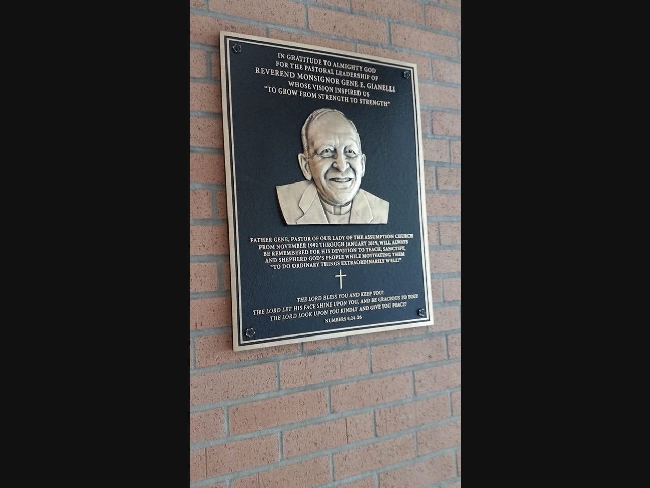 The plaque honoring Fr. Gene in the Center Road church
