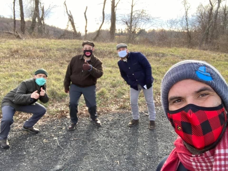 Actors in masks between takes