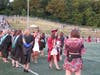 NPS photographer Laraine Weschler takes photos of the graduates as they exit the field